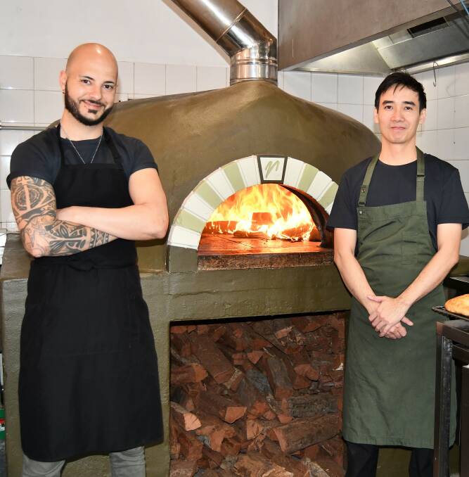 Church Bar chefs Marco Marano and Irwan Kok busy cooking pizzas following the reopening of the business. Picture: Amy Rees