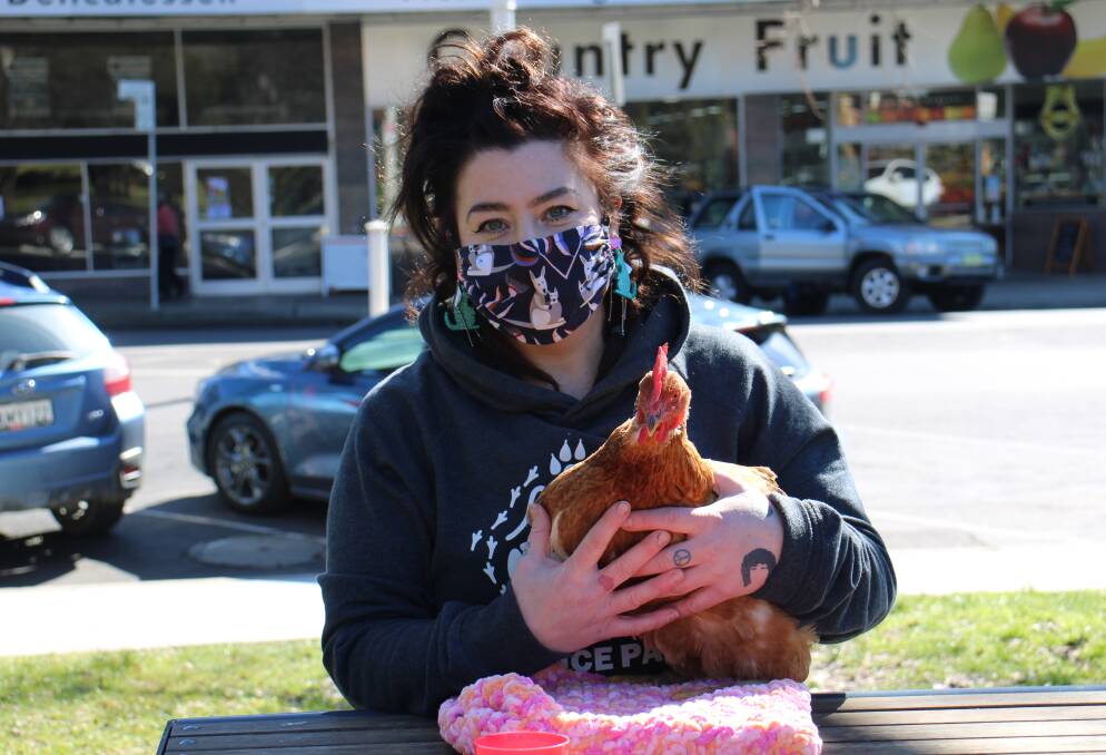 CLUCKY: Queenie Green with her first rescue hen, Lady. Photo: AMY REES
