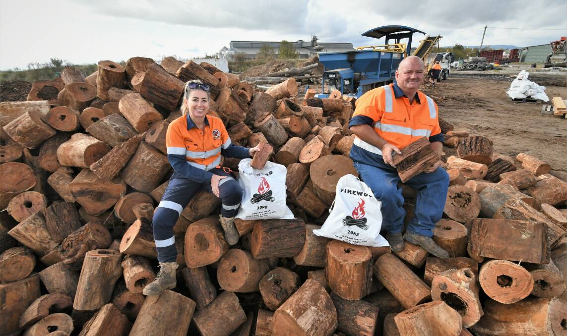 WINTER WARMING: Central West Firewood and Landscape's Leanne Fitzgerald and Stuart Turner with premium ironbark. Photo: CHRIS SEABROOK.