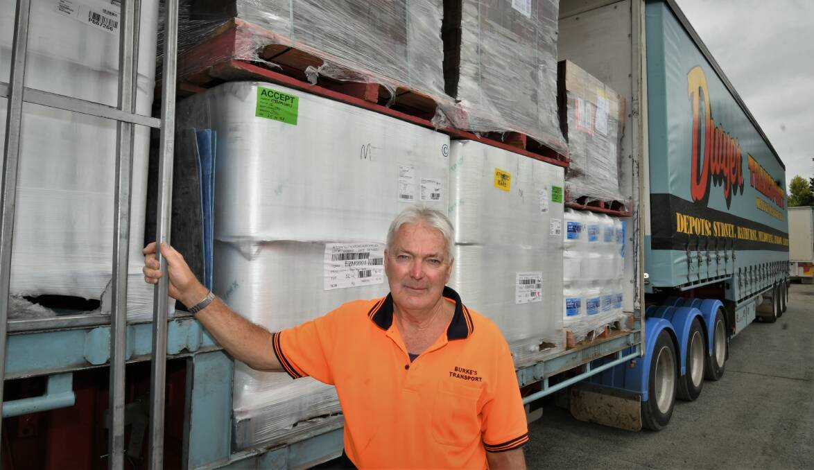 CHALLENGING TIMES: Burke's Transport owner Graeme Burke is working hard to juggle reduced staff numbers and high demand. Photo: CHRIS SEABROOK