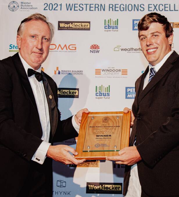 AWARD: James Gordon being handed his apprentice of the year award by MBA president Brian Seidler. Photo: RHIANNON TAYLOR EVENT PHOTOGRAPHY.
