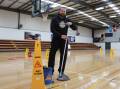 Bathurst Goldminers board member Iain Wood mopping up after yet another major leakage at the Bathurst Indoor Sports Stadium, following significant rainfall on April 5, 2024. Picture by Amy Rees