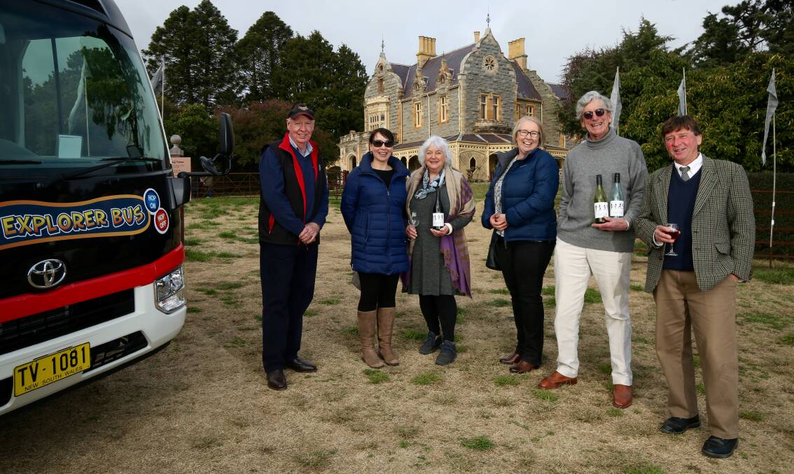 WINE TOURS: Bus driver Allen Gavin with wine tour guests and Abercrombie House owner Christopher Morgan. Photo: PHIL BLATCH.