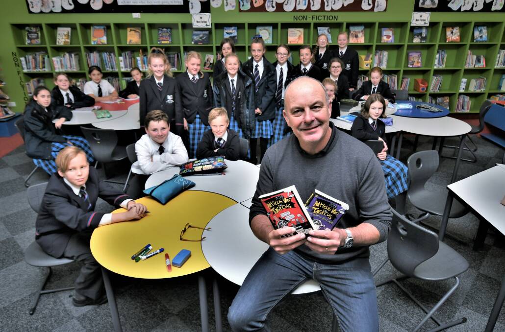 LITERACY FESTIVAL: Author Andrew Daddo speaking at the Scots All Saints College west campus on Monday. Photo: CHRIS SEABROOK