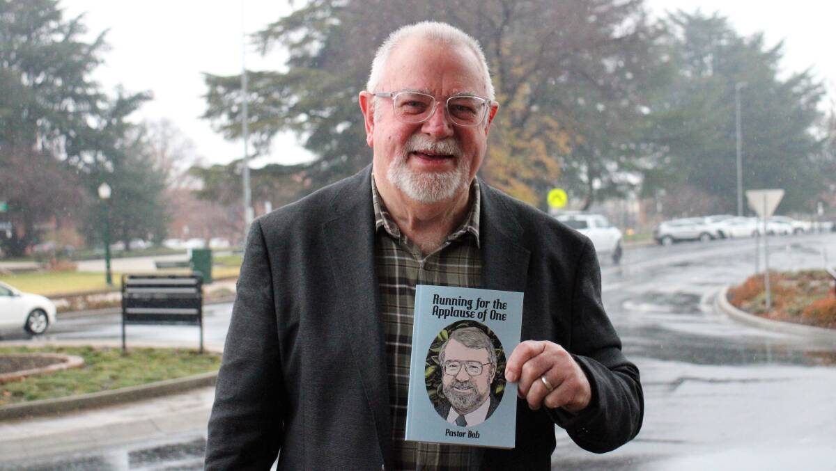 LIFE WELL LIVED: Pastor Bob Smith with his recently-published autobiography, Running For The Applause Of One, which he officially launched on Sunday. Photo: AMY REES