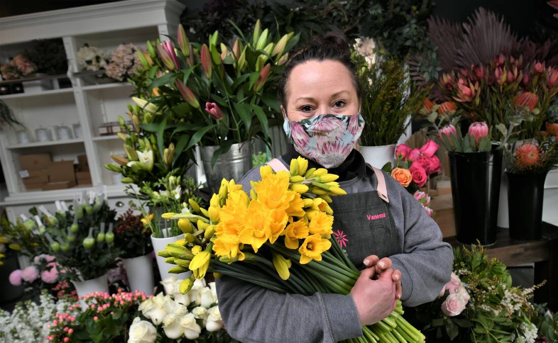 FLOWER POWER: Vanessa Pringle is selling bunches of daffodils to raise money for the Bathurst Daffodil Wig Library. Photo: CHRIS SEABROOK
