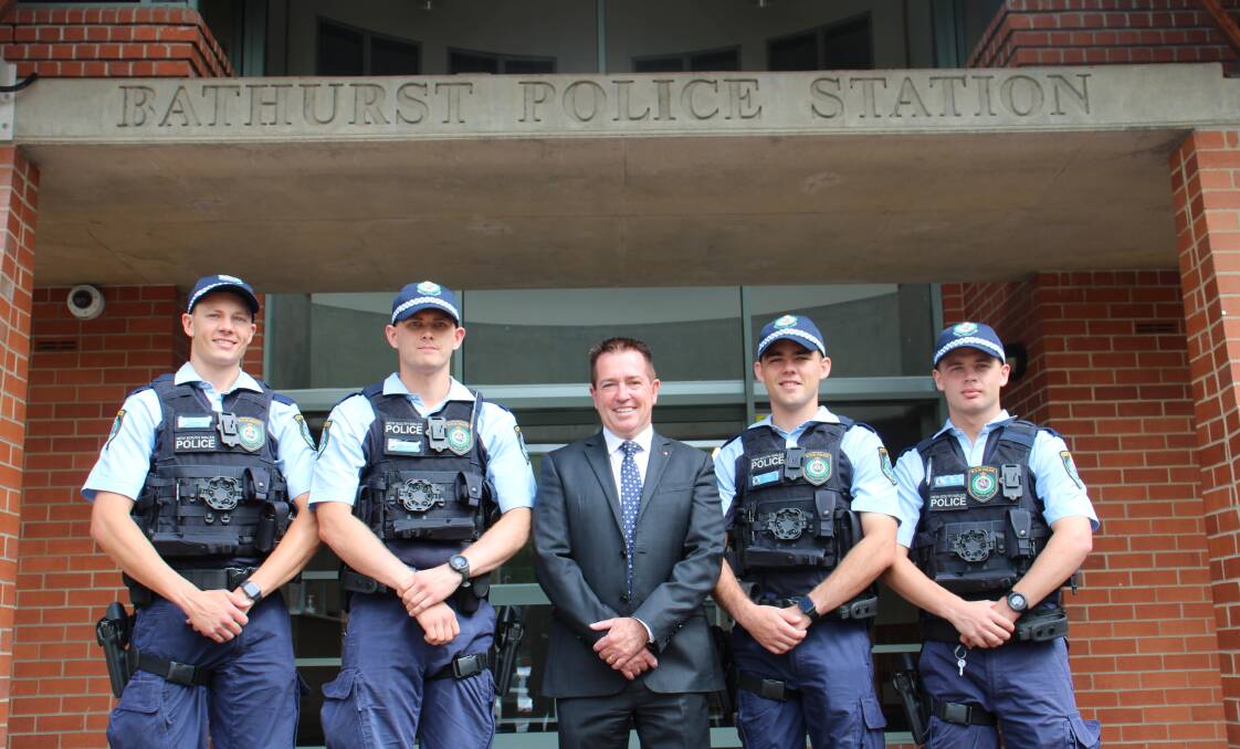 NEW RECRUITS: Brandon Eggleton, Jordan Cartwright, MP Paul Toole, Dylan Miles and Josh Carpenter after their induction to the police force. Photo: AMY REES
