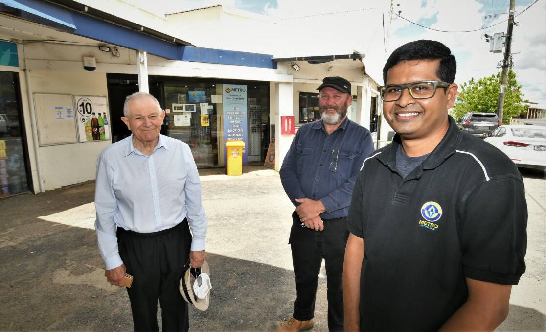 HELPING HAND: Perthville Development Group vice-president John Trollor, secretary Garth Courtney and Metro Petroleum Perthville part-owner Ramu Metpally are hoping for some community support on Australia Day. Photo: CHRIS SEABROOK