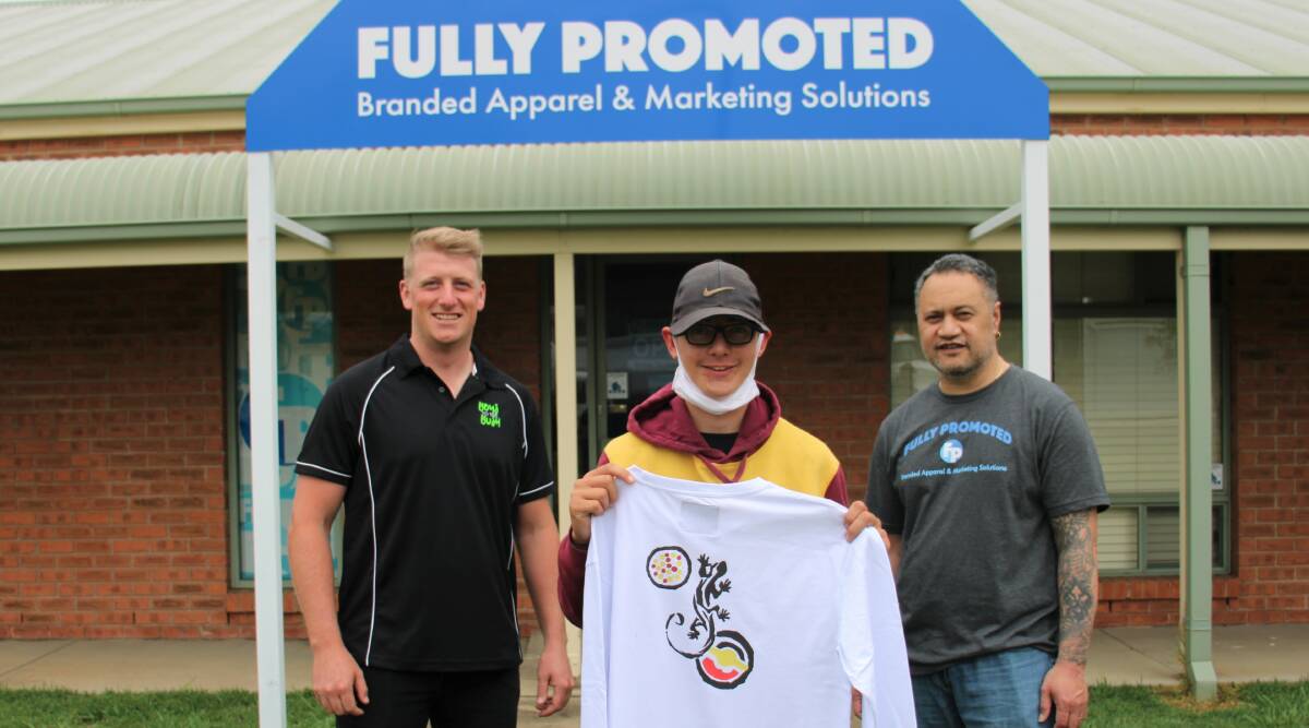 PRIDE AND JOY: Boys To The Bush mentor Jordan Naylor with Fully Promoted part-owner Stan Luisi and a young artist Zandah Laws. Photo: AMY REES.