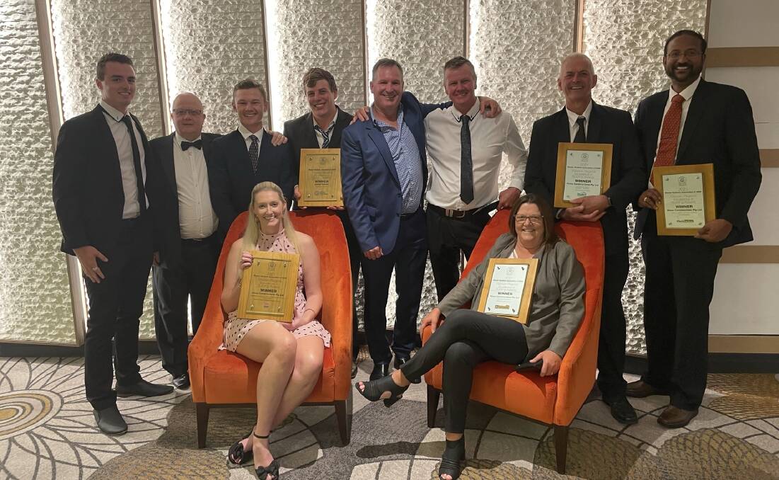 WINNERS ARE GRINNERS: Hines Constructions managing director David Hines with his team after receiving five awards at the 2021 MBA Awards. Photo: SUPPLIED.