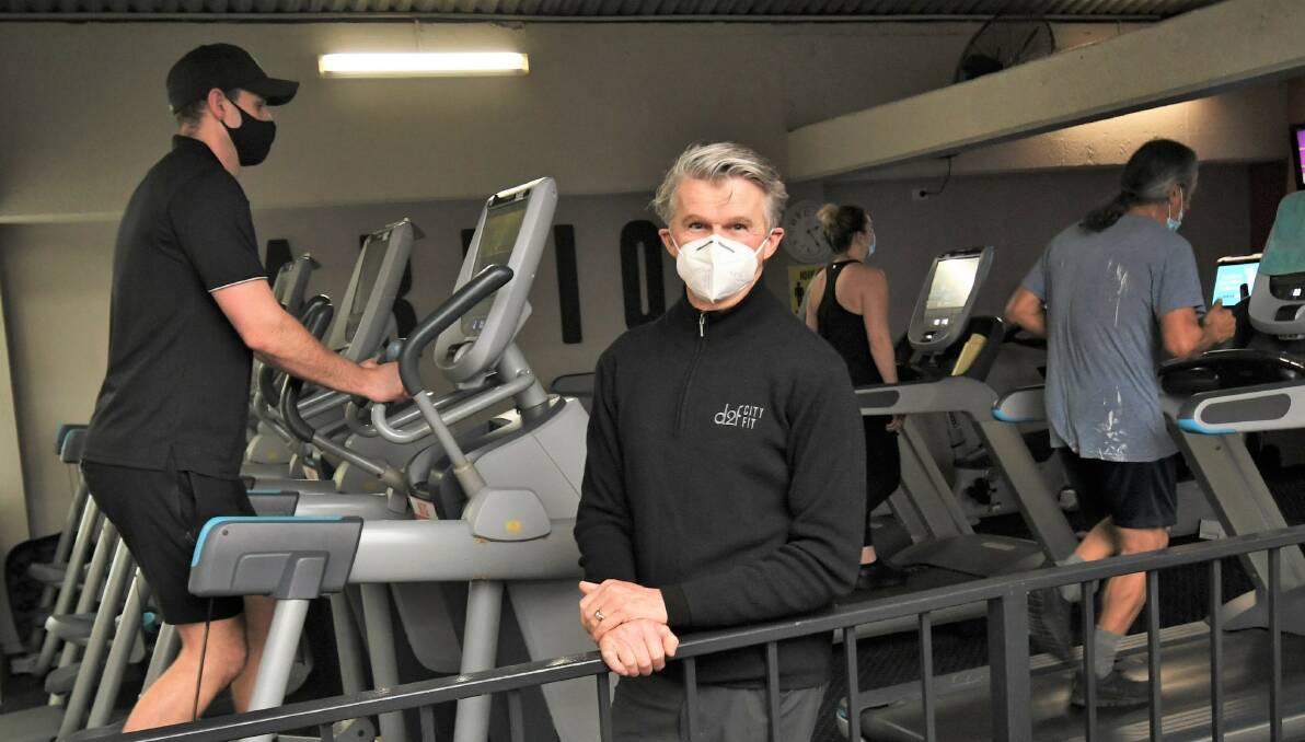 MASK UP: Cityfit owner Mark Simons says masks are just a phase for gym goers. Photo: CHRIS SEABROOK.