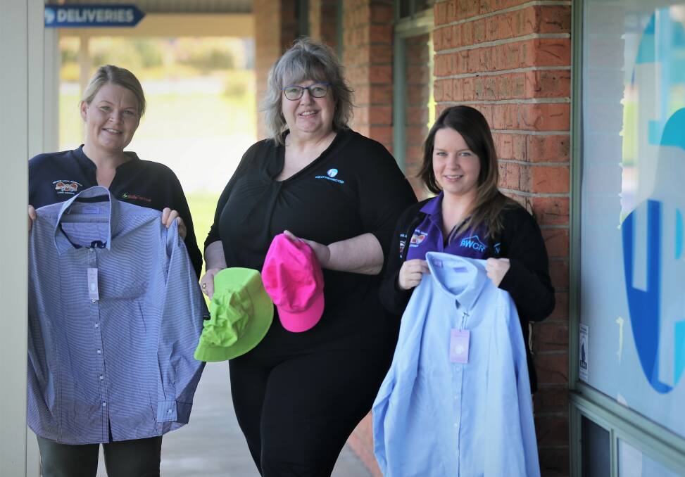 DONATION: Wattle Tree's Bec Anderson and Yasmin Dowling thankful for Liz Luisi's (middle) donation. Photo: PHIL BLATCH.