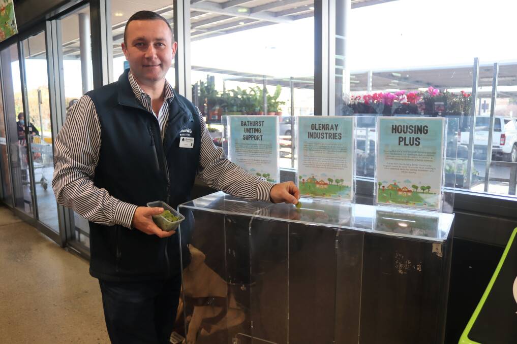 Bernardi's Bathurst manager Aaron Randal with the donation tubs. Picture: Amy Rees