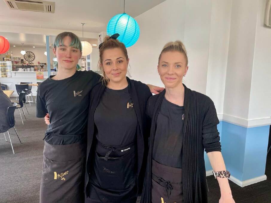 Country Coffee employees Megan Dixon and Elyshia Burrell with new owner Jane Issa. Picture: Amy Rees