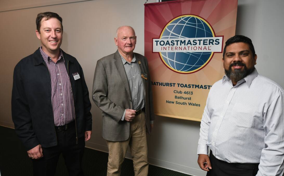 CELEBRATION: Toastmasters Bathurst committee members Brad McWilliams, Merv Tobin and Henry Jayawardena. Photo: CHRIS SEABROOK