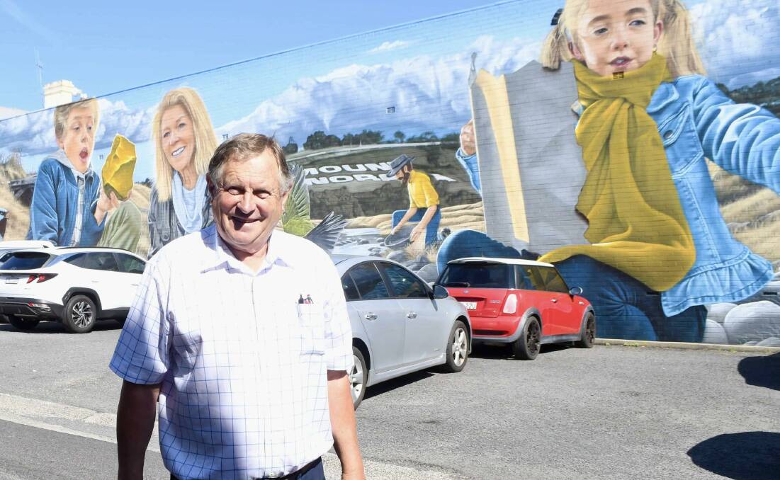 Bathurst businessman Peter Rogers on February 19, 2024, in front of the mural he commissioned which was painted by Callum Hotham. Picture by Amy Rees