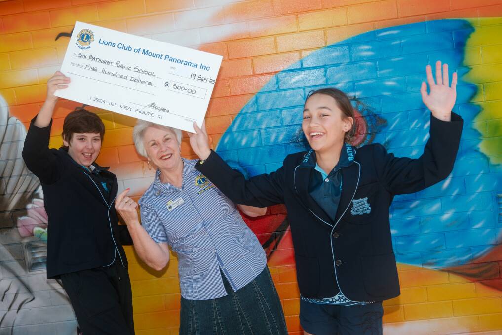 School Captain Lachlan Sing and Dana Janssen excited to receive the $500 donation from Mount Panorama Lions Club president Sally Coops on Tuesday, September 19, 2023. Picture by James Arrow