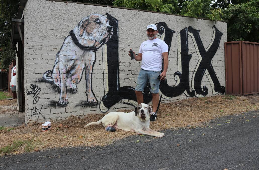 MUSE: Lux pleased to be the muse for a mural painted by local artist Stephen 'Sven' Rogers. Photo: AMY REES.