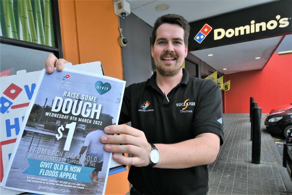 FLOOD RELIEF: Bathurst Dominos operations manager Thomas Dibley ready to raise some dough to assist flood victims. Photo: CHRIS SEABROOK.