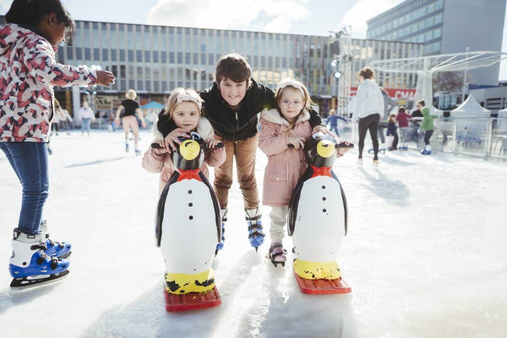 One benefit of cold Canberra winters - Wintervention at Civic. Zoey Bodman, 3, Fletcher Bruce, 8, and Emma Bodman, 3, seen enjoying the snow. Picture: Dion Georgopoulos