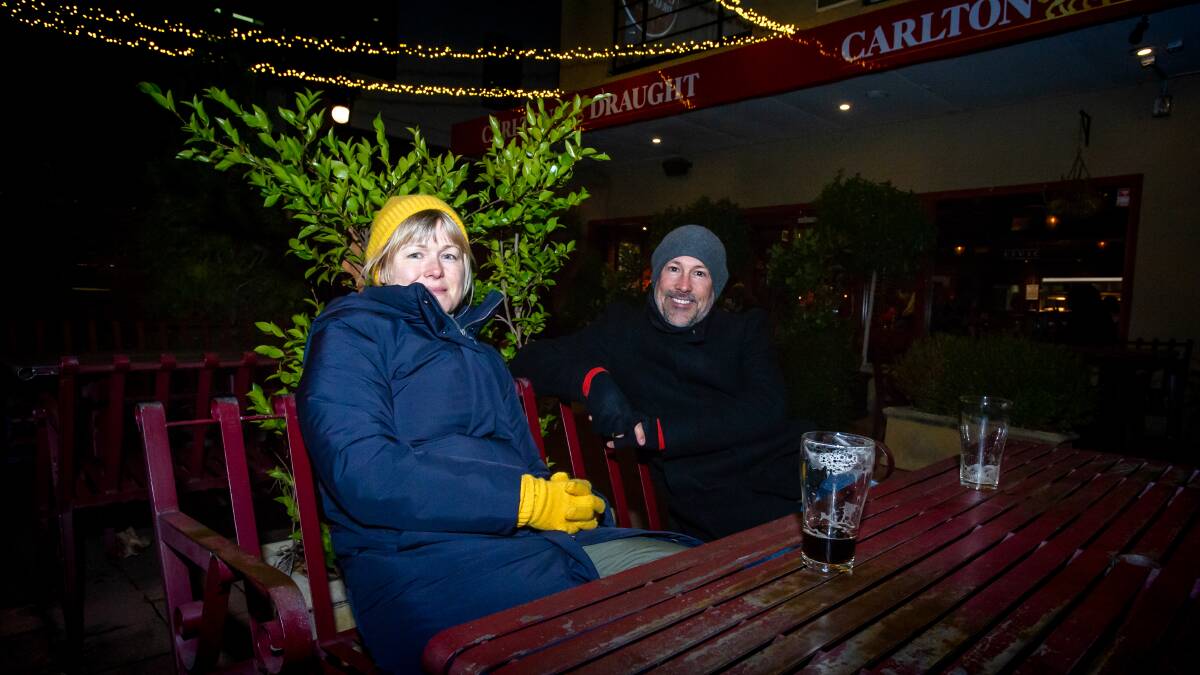 Lucy Butcher and John Noble rugged up for a cold one at the Civic Pub. Picture: Elesa Kurtz