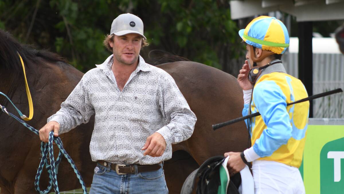 LIP SERVICE: Trainer Brett Robb discusses Lipstick Lil's run with jockey Ash Morgan after the trio combined for a win at Towac Park yesterday. Photo JUDE KEOGH