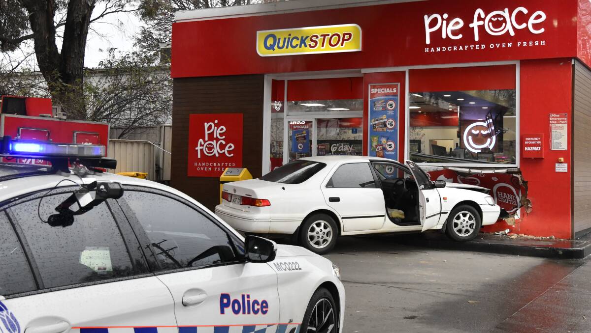 Toyota Camry crashes into United Petroleum fuel station in Orange, NSW Police on the scene. Picture by Carla Freedman. 