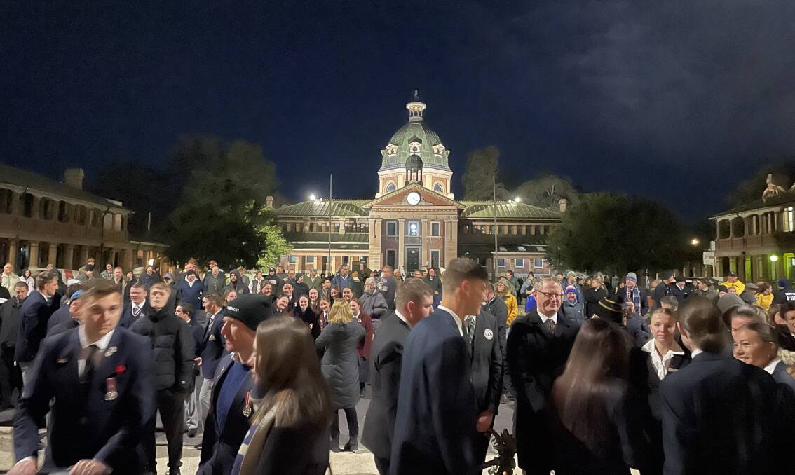The Bathurst Courthouse was alight as crowds stood facing the War Memorial Carillon for the Anzac Day Dawn Service. Picture by Alise McIntosh
