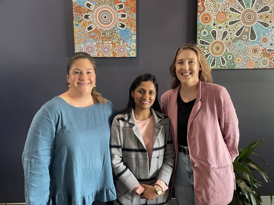 Nina Barnes, Shomie Prasad and Gemma Dixon smiling from the Relationships Australia Bathurst office. Picture by Alise McIntosh