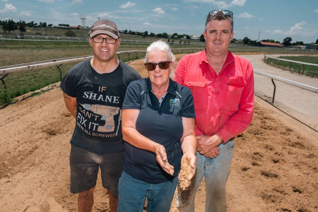 Shane Adams, Bathurst Thoroughbred Racing manager Lisa Pierce and John Condon on the new sand track. Picture by James Arrow.