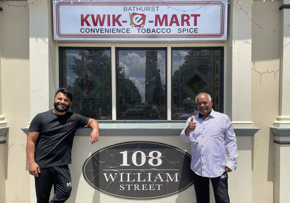 Ali Cheema and his father Cheema Senior out the front of the new Kwik-E-Mart store on William Street. Picture by Alise McIntosh