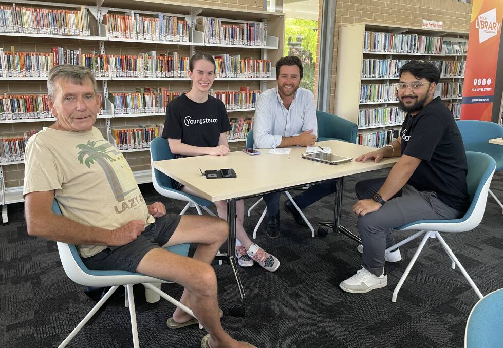 Trevor Hickey, with Youngster.co worker Jorja Dickie, deputy mayor Benjamin Fry and Youngster.co employee Anurag Rupakhetee at the Bathurst Library Connecting Seniors Program. Picture by Alise McIntosh