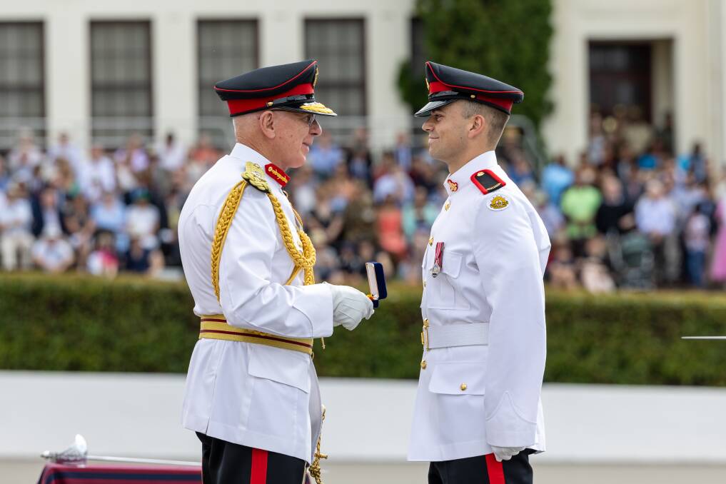 The Governor-General of the Commonwealth of Australia, His Excellency, General the Honourable David Hurley AC DSC (Retd) presenting the King's Medal to Staff Cadet Aiden Allen at the Royal Military College. Picture supplied by the Department of Defence