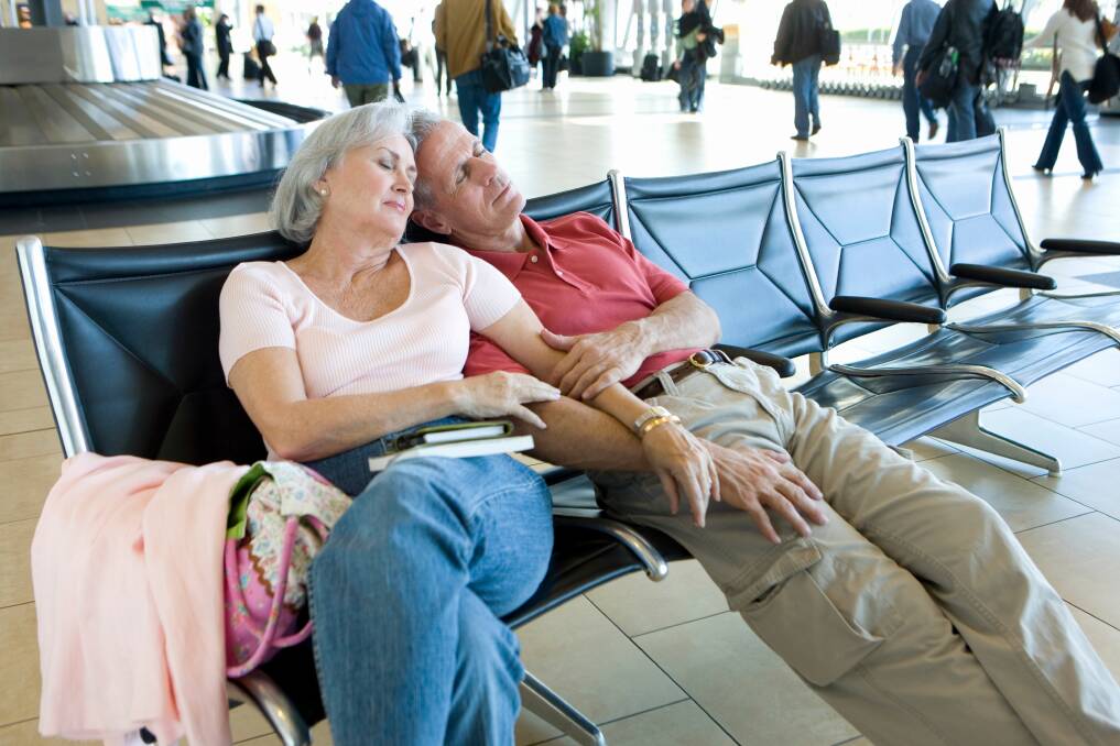 A couple asleep at the airport. Picture from shutterstock. 