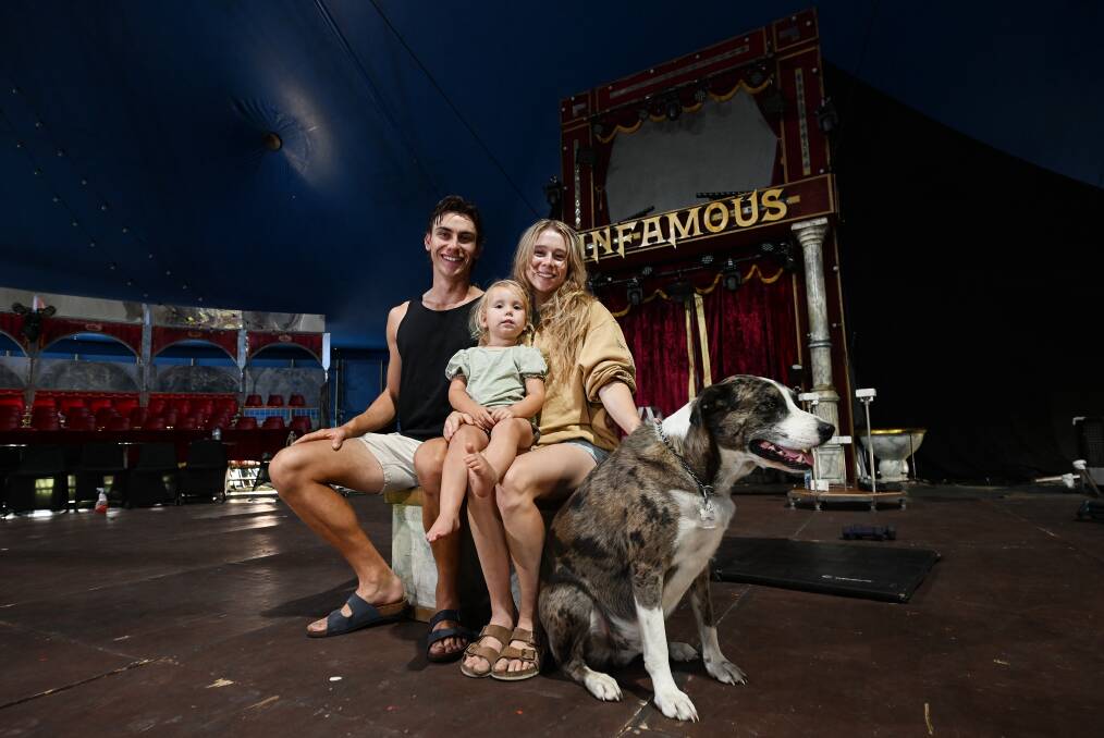 Kyle Wishart, two-year-old daughter Bindi Ashton Harrison Wishart, and Dante Ashton Harrison with one their dogs under the Infamous The Show big top. Picture by Gareth Gardner