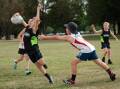 Jax Brennan dodges through the defense at the Bathurst touch football. Picture by James Arrow.