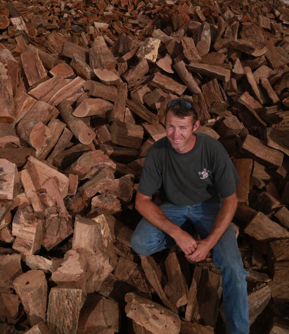 WINTER IS COMING: AAA Firewood's Lachlan Roberts at the AAA yard on Upfold Street. The coming cold weather means the inquiries are flooding in for firewood. Photo: PHIL BLATCH 041917pbwood3