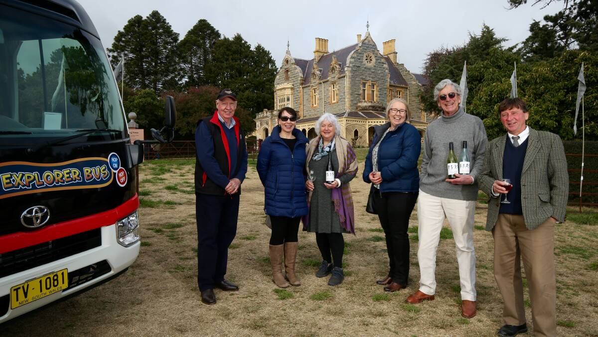 WINE TOURS: Bus driver Allen Gavin with wine tour guests and Abercrombie House owner Christopher Morgan during last month's tour. Photo: PHIL BLATCH.