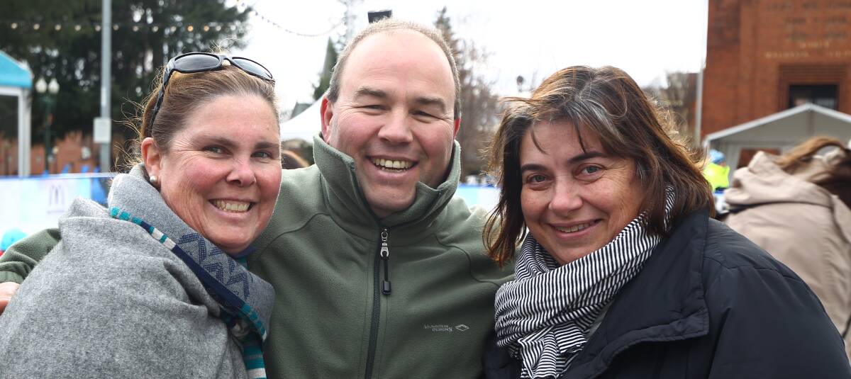 KEEPING WARM: Jenny and Grant Baker and Cath Evans. 070818pbskate7