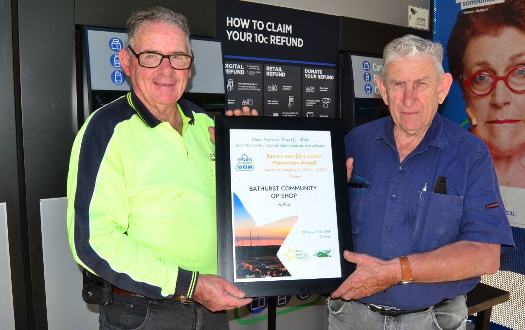 AWARD WINNERS: Bathurst Community Op Shop volunteers Lawrie Price (left) and Jim Wilds (right), pictured with the Return and Earn Litter Prevention Award. Photo: BRADLEY JURD