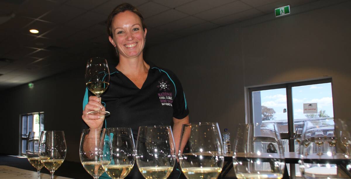 JUDGING: National Cool Climate Wine Show chairperson Lee Baxter at Panthers Bathurst, with some of the judged wines. Photo: BRADLEY JURD