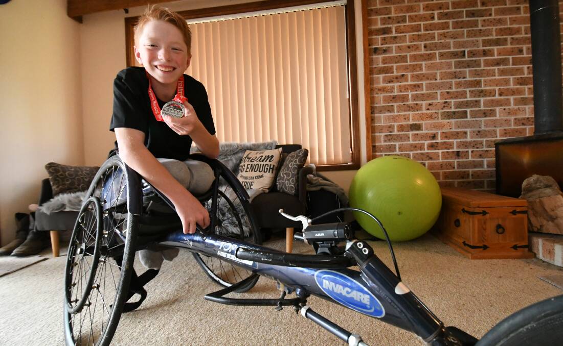 FIRST RACE: Fourteen-year-old Waryk Holmes has drawn great inspiration from Kurt Fearnley. He completed his first race in Sydney last month. Photo: CHRIS SEABROOK 060419cwaryk