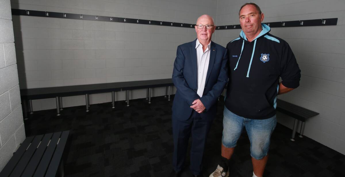NEW FEATURE: Bathurst mayor Graeme Hanger, with Bathurst District Football president Andrew Speed, within one of Proctor Park's new change rooms. Photo: PHIL BLATCH