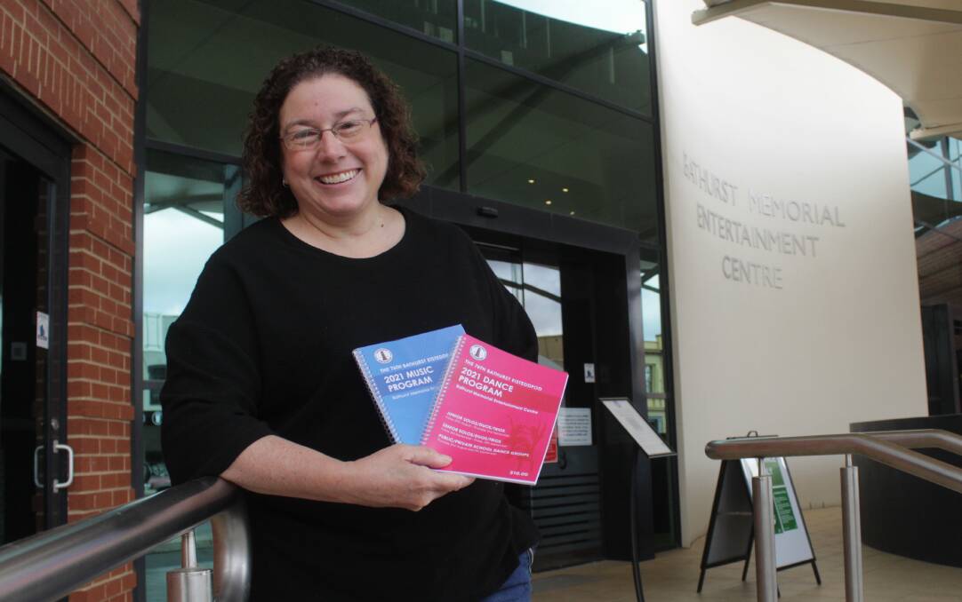 NOT LONG NOW: Bathurst Eisteddfod president Renee Fowler with some of the programs that are now available to purchase. Photo: BRADLEY JURD