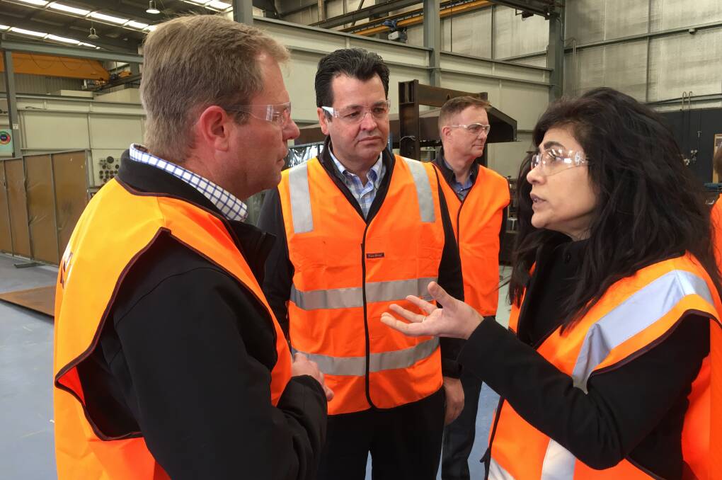 TOUR: Truflo Pumping Systems national sales manager Gavin Allbut (left) speaking with SMaRT@UNSW 's director Veena Sahajwalla (right) and Advanced Manufacturing Growth Centre director Michael Sharpe (centre). 