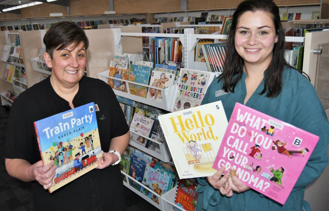 Bathurst Library's Mel Short with program team leader Tori Murray promoting Book Week. Photo: CHRIS SEABROOK 081622cbkwk