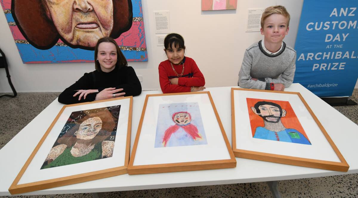 WINNERS: Josephine Jackson, Anabia Naz and Charlie O'Brian with their winning artworks. Photo: CHRIS SEABROOK 081520carchie6 