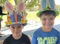 Jaxon Phillips and Chase Parkes proud as punch of their fancy hats for the Easter hat parade at Bathurst Public. Picture by Bradley Jurd