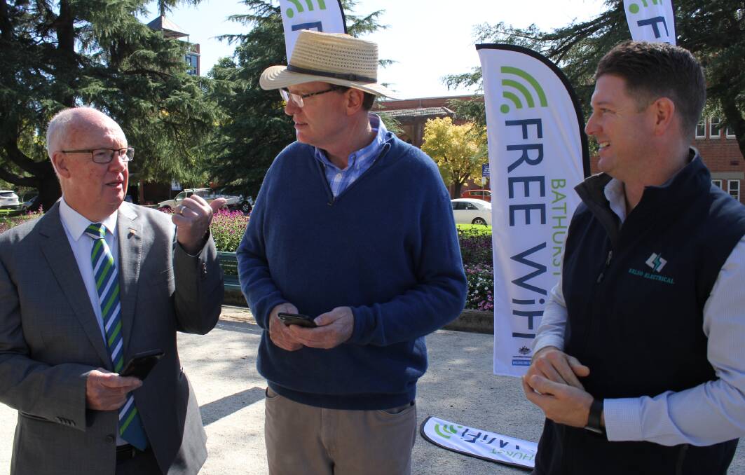 FREE WI-FI: Bathurst mayor Graeme Hanger (left), with Member for Calare Andrew Gee and Kelso Electrical director Brad Schumacher. Photo: BRADLEY JURD