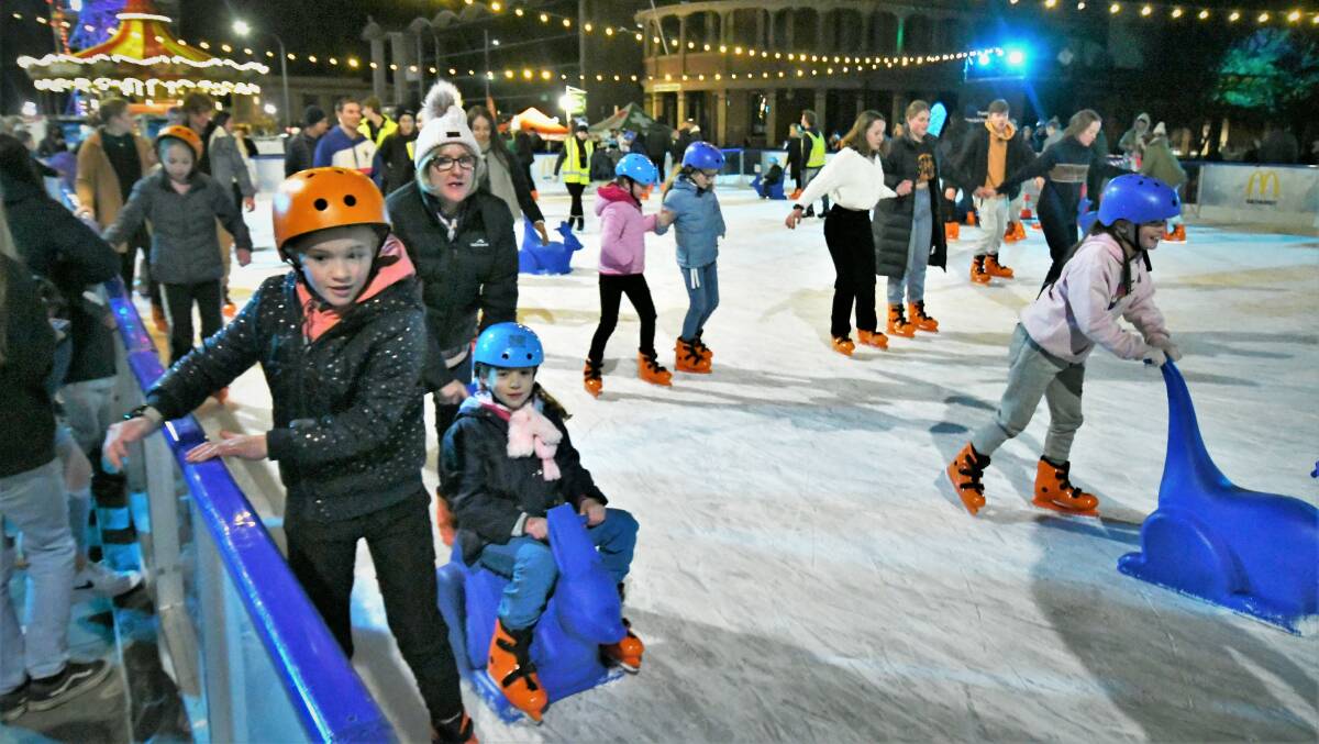 ON THE ICE: The ice skating rink proved to be a big attraction on Saturday evening at the Bathurst Winter Festival. Photo: CHRIS SEABROOK 070922cwintrfst10